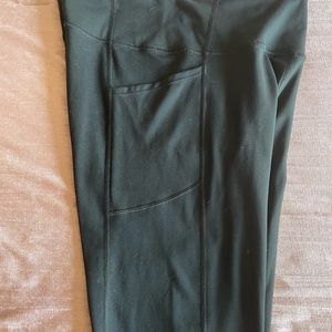 Size large black Victoria’s Secret leggings with side pockets.